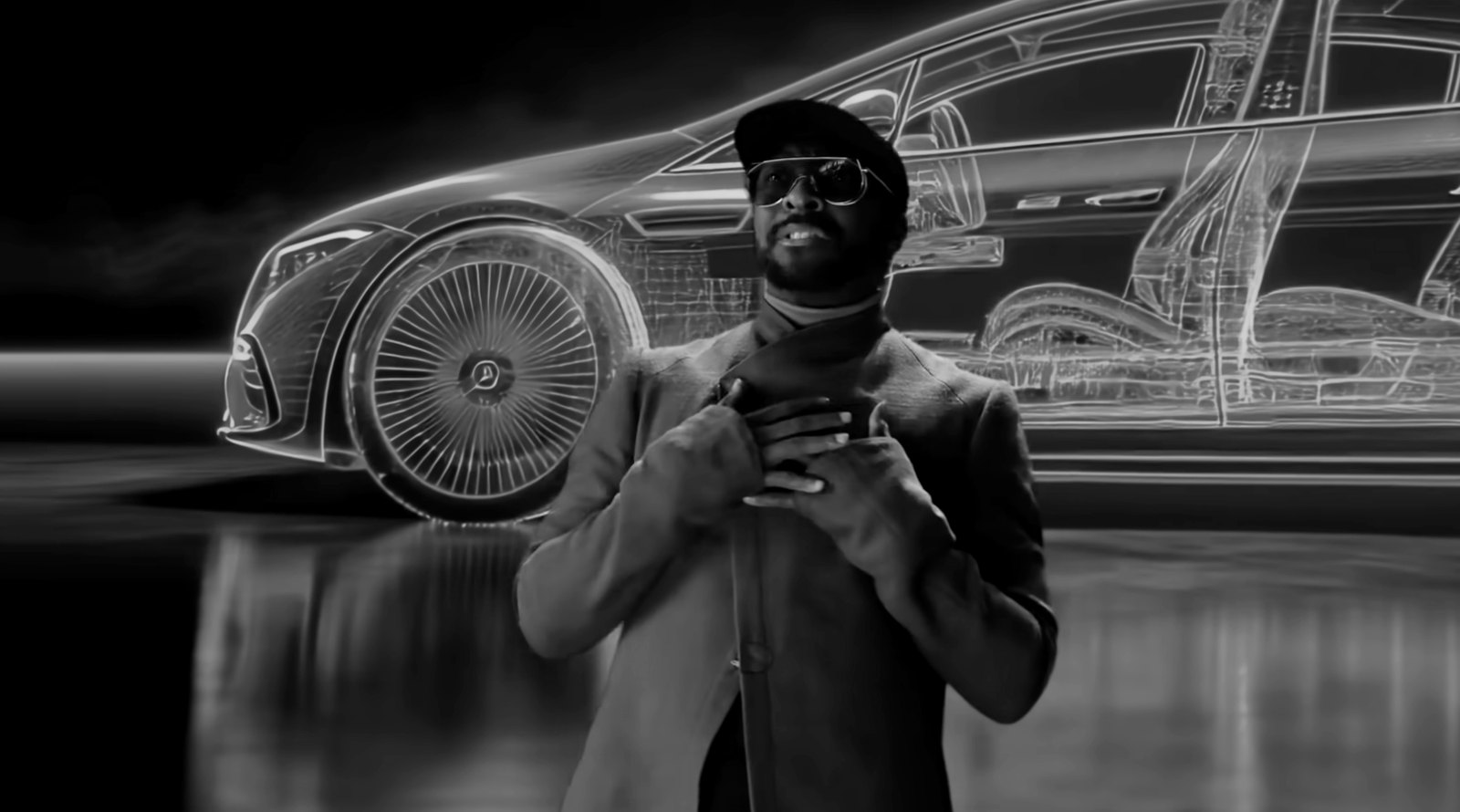 Still from will.i.am × Mercedes-Benz: will.i.am in front of a glowing wireframe car